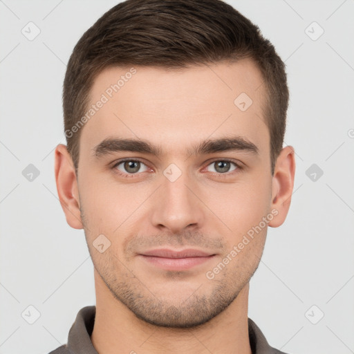 Joyful white young-adult male with short  brown hair and brown eyes