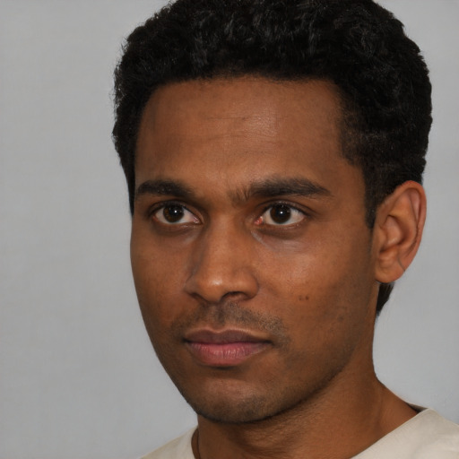 Neutral black young-adult male with short  black hair and brown eyes