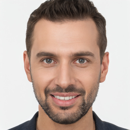 Joyful white young-adult male with short  brown hair and brown eyes