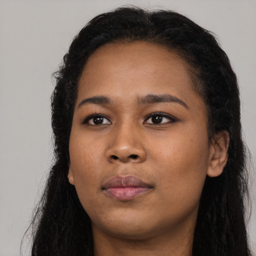 Neutral black young-adult female with long  black hair and brown eyes