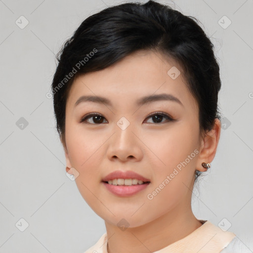 Joyful asian young-adult female with short  brown hair and brown eyes