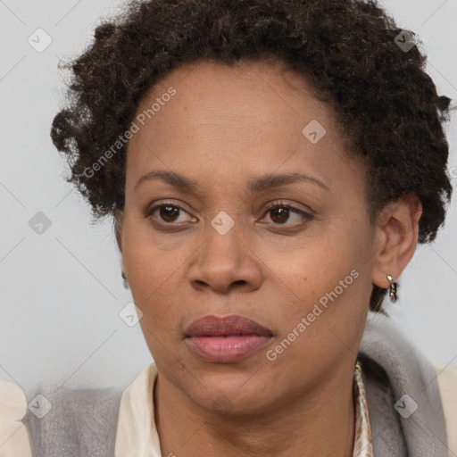 Joyful black adult female with short  brown hair and brown eyes