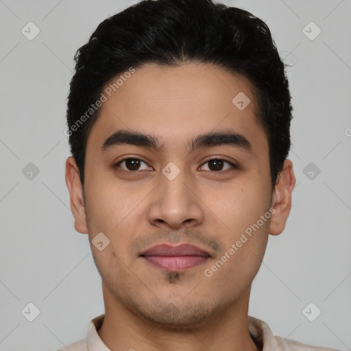 Joyful latino young-adult male with short  black hair and brown eyes