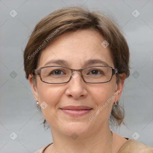 Joyful white adult female with medium  brown hair and grey eyes