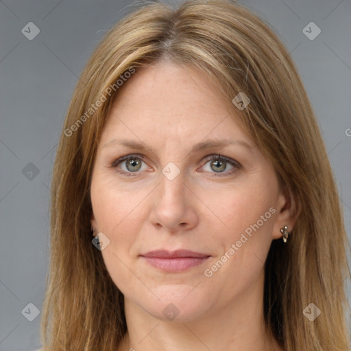 Joyful white adult female with long  brown hair and brown eyes