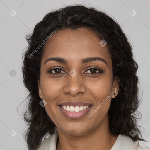 Joyful black young-adult female with long  brown hair and brown eyes