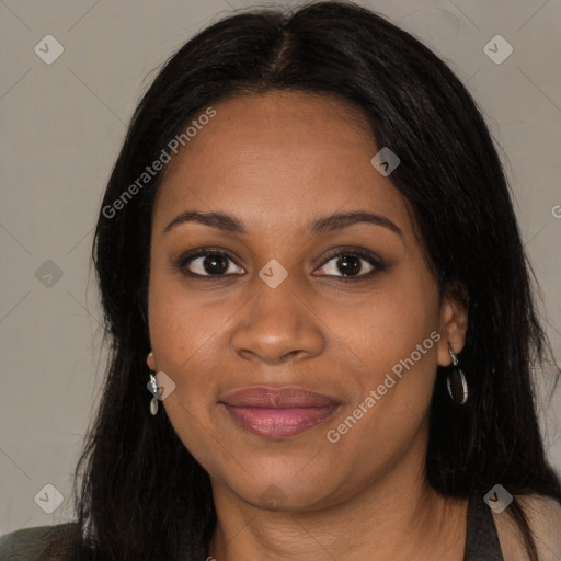 Joyful black young-adult female with long  black hair and brown eyes