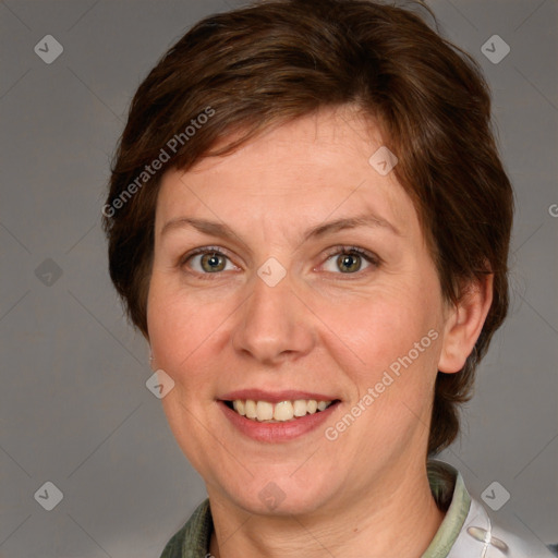 Joyful white adult female with medium  brown hair and grey eyes