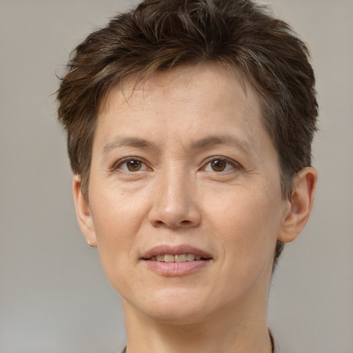 Joyful white adult female with short  brown hair and brown eyes