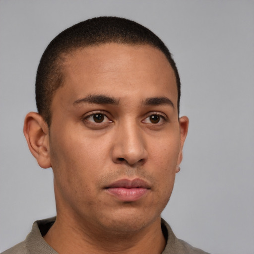 Neutral latino young-adult male with short  brown hair and brown eyes