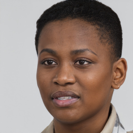 Joyful black young-adult female with short  black hair and brown eyes