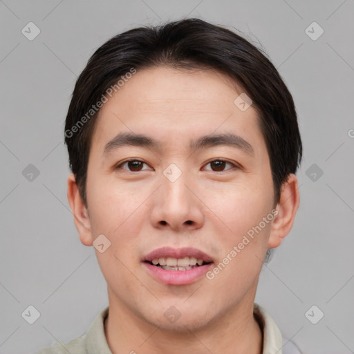 Joyful asian young-adult male with short  brown hair and brown eyes