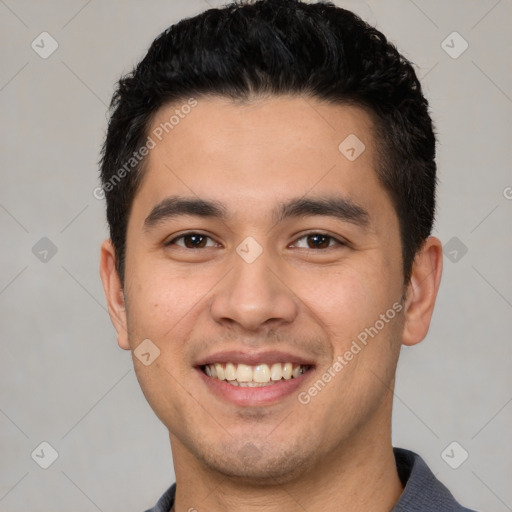 Joyful white young-adult male with short  black hair and brown eyes