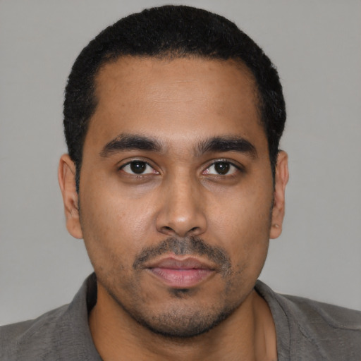 Neutral black young-adult male with short  black hair and brown eyes
