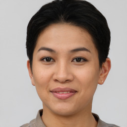 Joyful asian young-adult female with short  brown hair and brown eyes