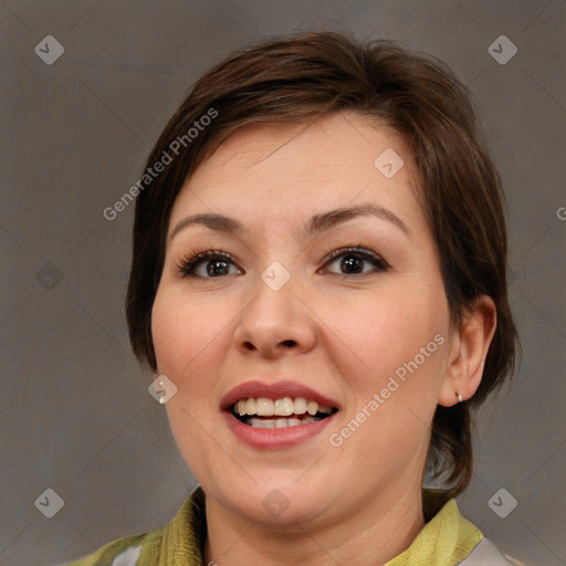 Joyful white adult female with medium  brown hair and brown eyes