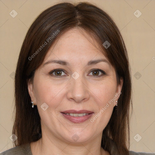 Joyful white adult female with medium  brown hair and brown eyes