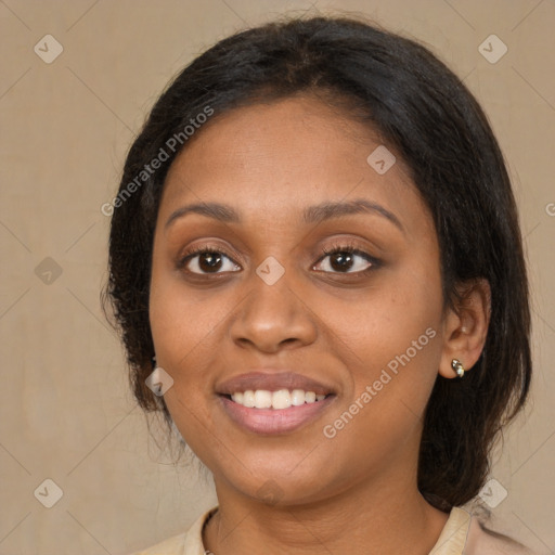 Joyful latino young-adult female with medium  brown hair and brown eyes