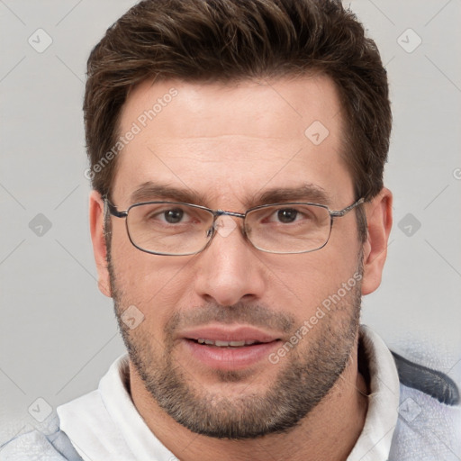 Joyful white adult male with short  brown hair and brown eyes