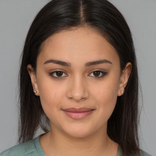 Joyful white young-adult female with long  brown hair and brown eyes