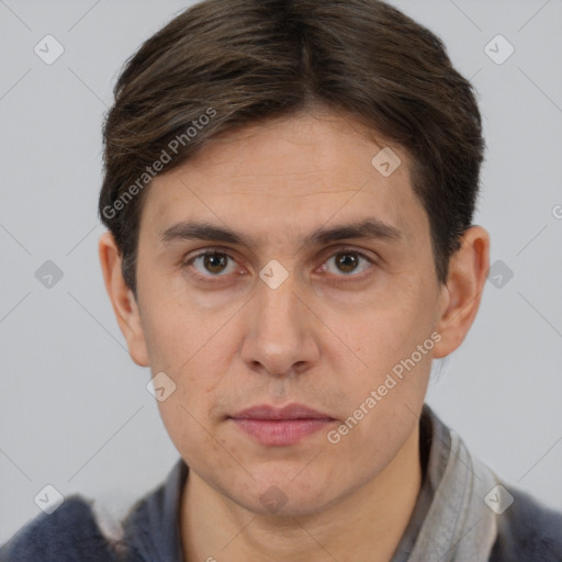 Joyful white adult male with short  brown hair and brown eyes