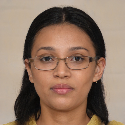 Neutral latino adult female with medium  brown hair and brown eyes