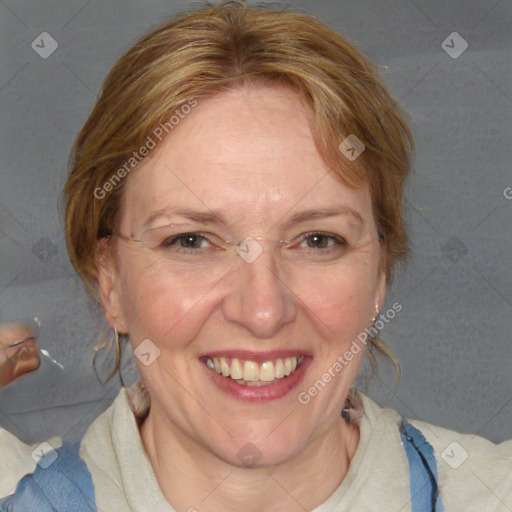 Joyful white adult female with medium  brown hair and blue eyes