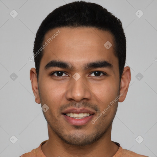 Joyful latino young-adult male with short  black hair and brown eyes