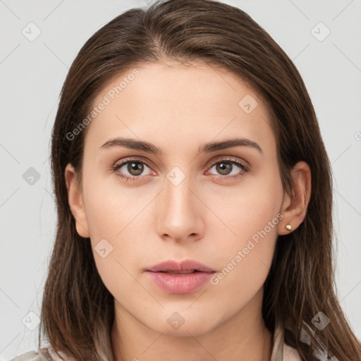 Neutral white young-adult female with long  brown hair and brown eyes