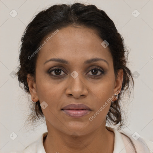 Joyful black young-adult female with long  brown hair and brown eyes