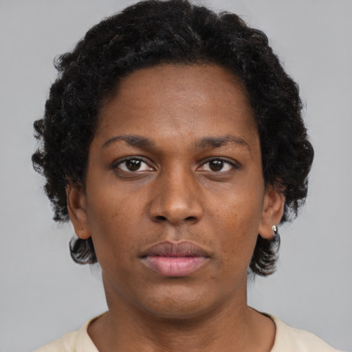 Neutral black adult female with short  brown hair and brown eyes