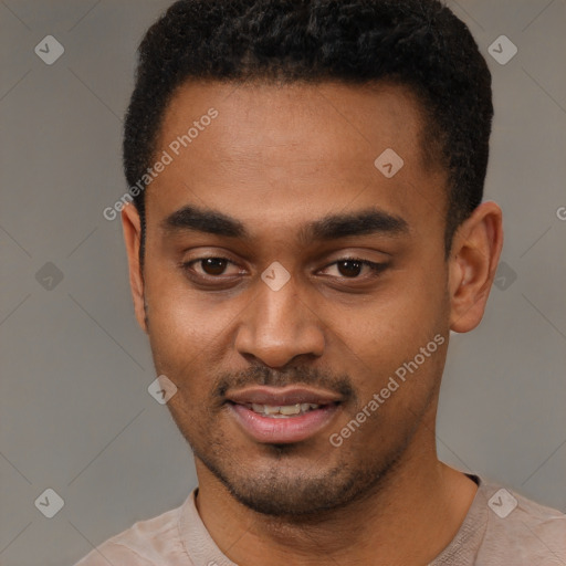 Joyful black young-adult male with short  black hair and brown eyes