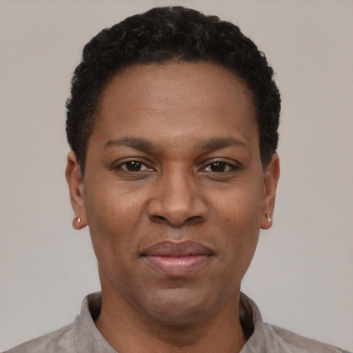 Joyful latino adult female with short  black hair and brown eyes