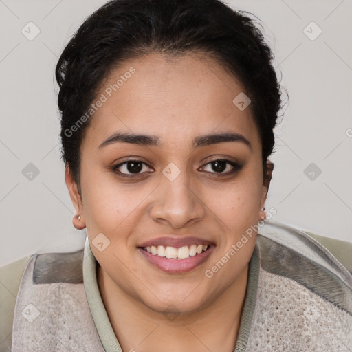 Joyful latino young-adult female with short  brown hair and brown eyes