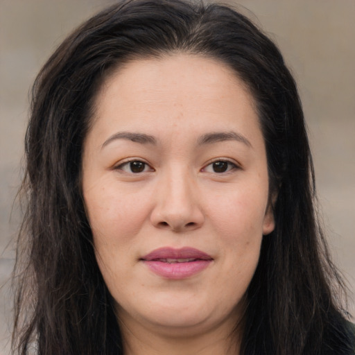 Joyful asian young-adult female with long  brown hair and brown eyes