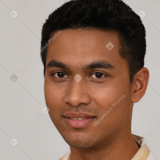 Joyful latino young-adult male with short  black hair and brown eyes