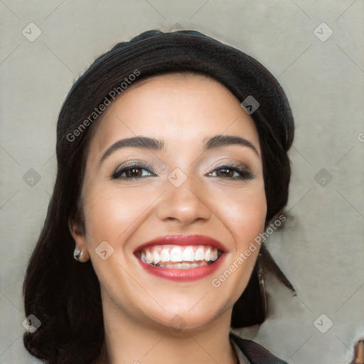 Joyful white young-adult female with long  black hair and brown eyes