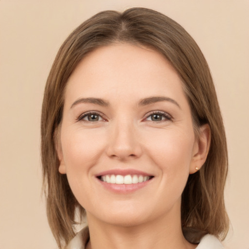 Joyful white young-adult female with medium  brown hair and brown eyes