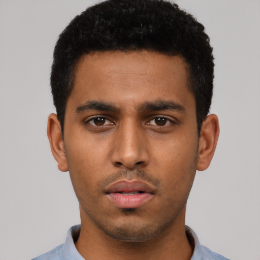 Neutral latino young-adult male with short  black hair and brown eyes