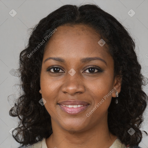 Joyful black young-adult female with long  brown hair and brown eyes