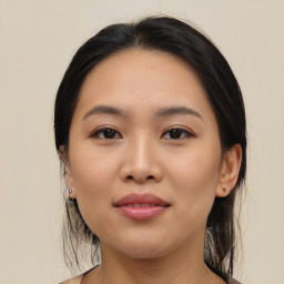 Joyful asian young-adult female with medium  black hair and brown eyes