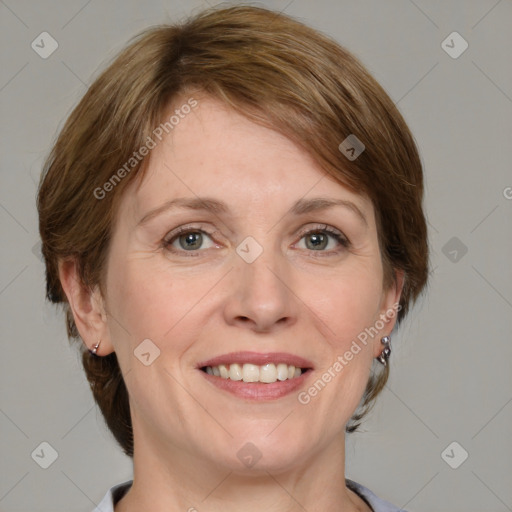 Joyful white adult female with medium  brown hair and grey eyes