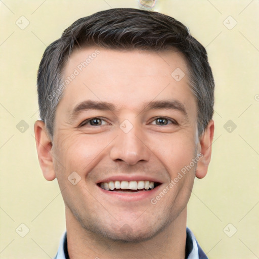 Joyful white young-adult male with short  brown hair and brown eyes