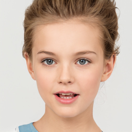 Joyful white child female with short  brown hair and brown eyes