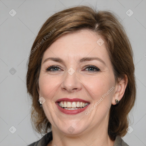 Joyful white young-adult female with medium  brown hair and blue eyes