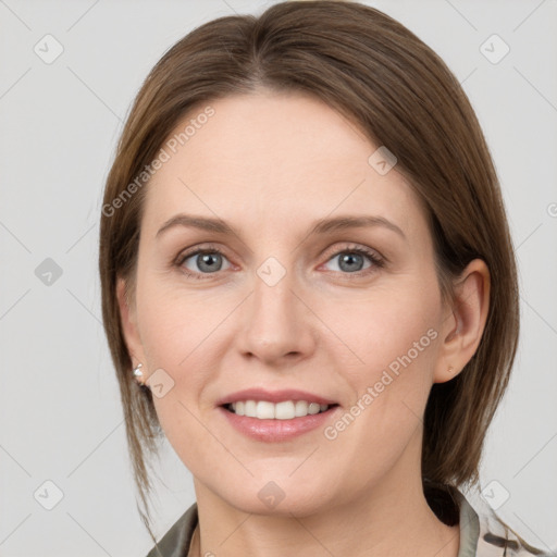 Joyful white young-adult female with medium  brown hair and grey eyes