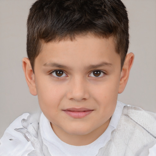 Joyful white child male with short  brown hair and brown eyes