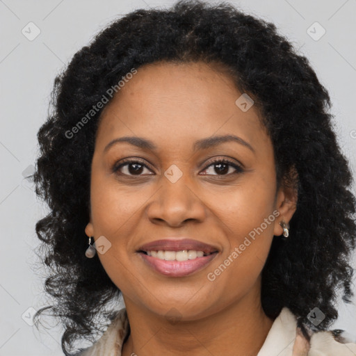 Joyful black young-adult female with long  brown hair and brown eyes