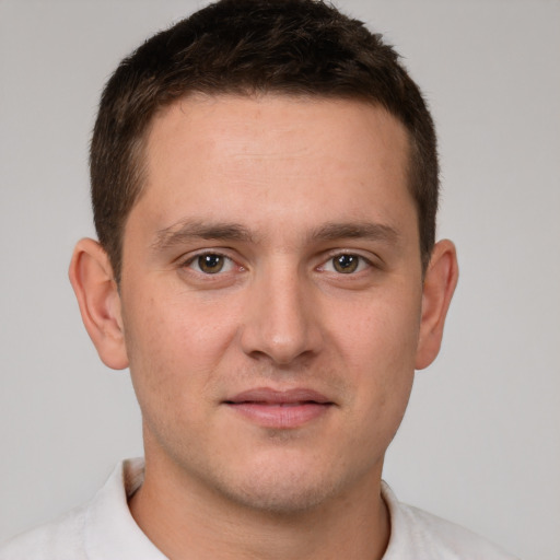 Joyful white young-adult male with short  brown hair and brown eyes