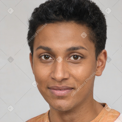 Joyful black young-adult male with short  brown hair and brown eyes